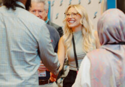 Interior designer Madi Goodrich greets attendees after presenting at the Offsite Construction Summit